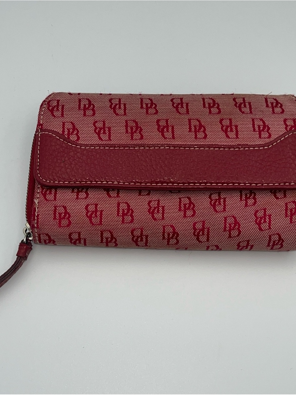 Vintage Dooney & Bourke Jacquard logo trifold wallet. Red